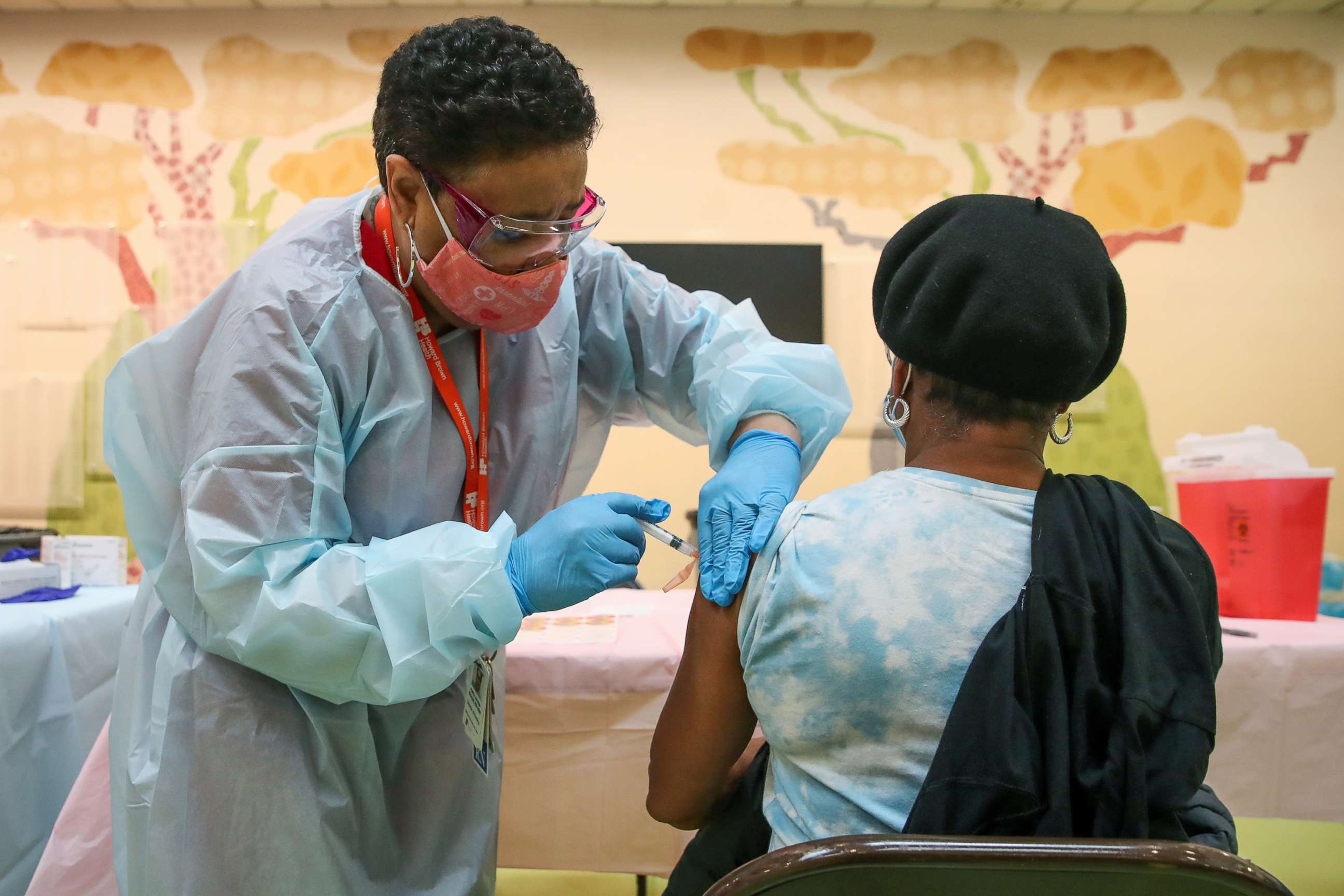 PHOTO: A woman receives the Moderna coronavirus disease (COVID-19) vaccination shot from nurse Kathy McLoyd at Trinity United Church of Christ in Chicago, Feb. 13, 2021. 