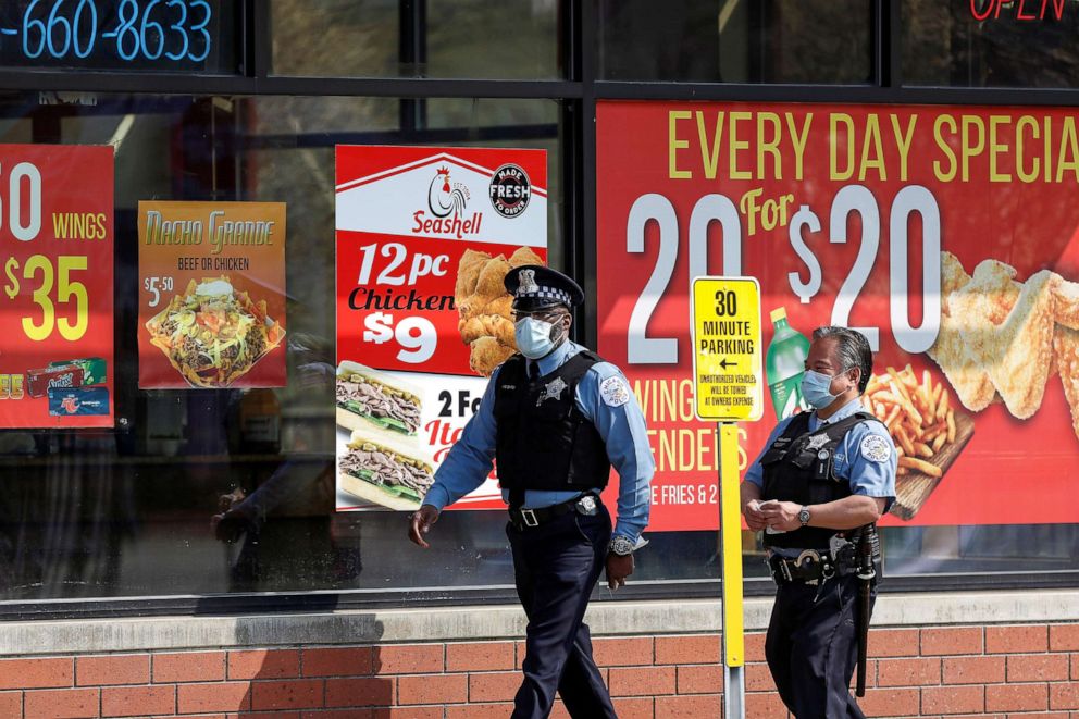 PHOTO: Chicago Police officers wear protective face masks outside Roseland Community Hospital in Chicago, April 7, 2020. during the global outbreak of the coronavirus disease (COVID-19).