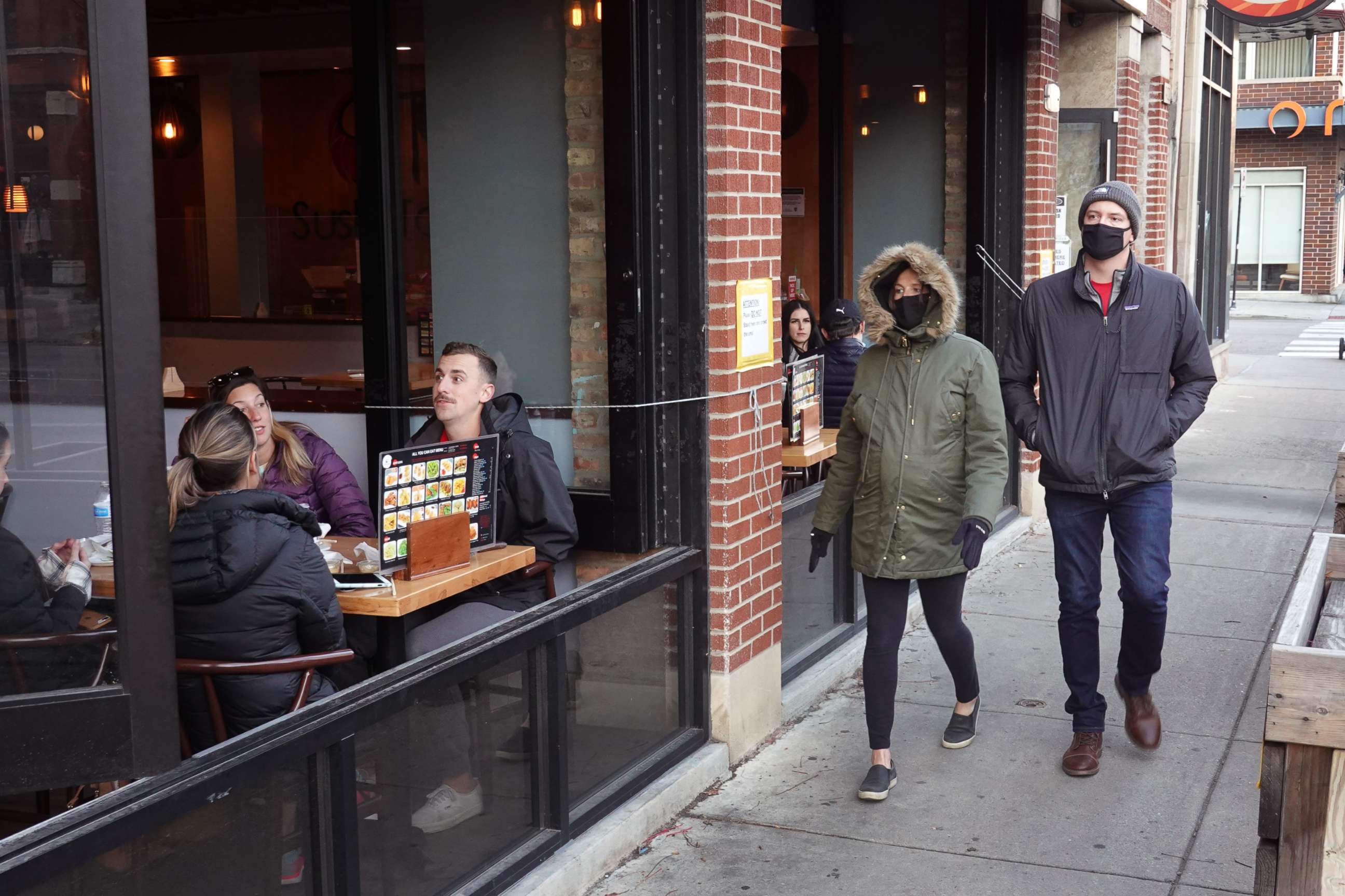 PHOTO: Despite temperatures in the mid-forties, customers continue to patronize restaurants and bars in the Wicker Park neighborhood on Nov. 11, 2020, in Chicago.