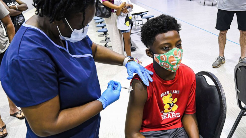 PHOTO: A nurse gives a boy a dose of the Pfizer vaccine at a vaccine clinic in Longwood, Fla., on Sept. 8, 2021, the day before classes begin for the 2021-22 school year.