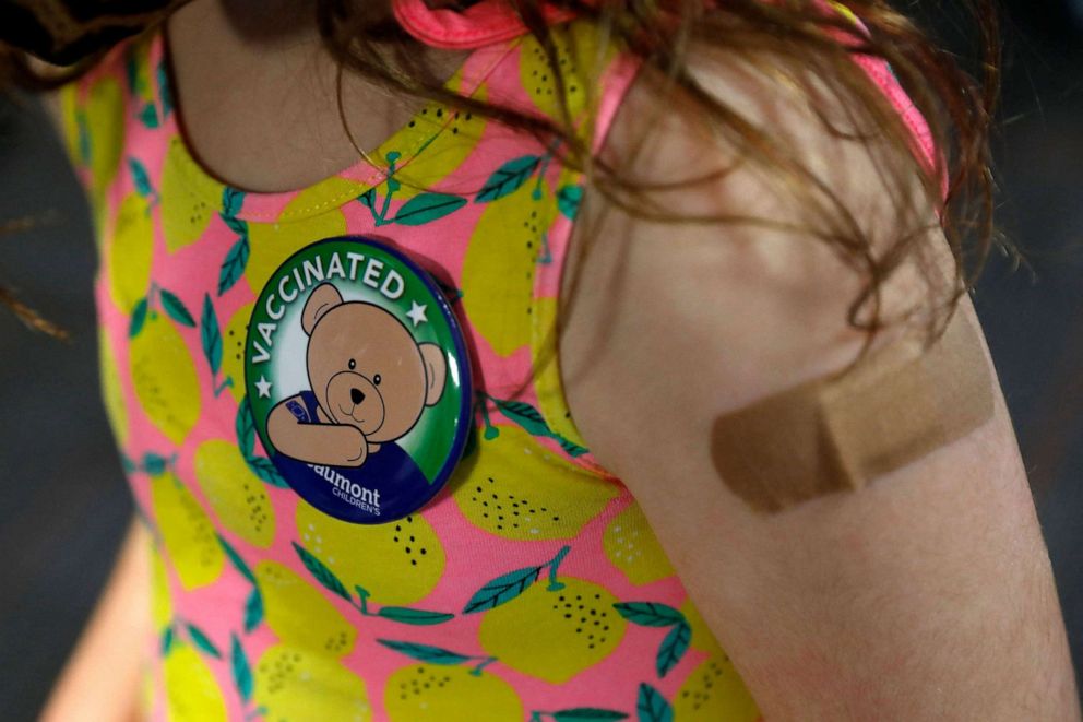 PHOTO: A child wears a pin she received after receiving her first dose of the Pfizer Covid-19 vaccine at the Beaumont Health offices in Southfield, Mich., on Nov. 5, 2021.