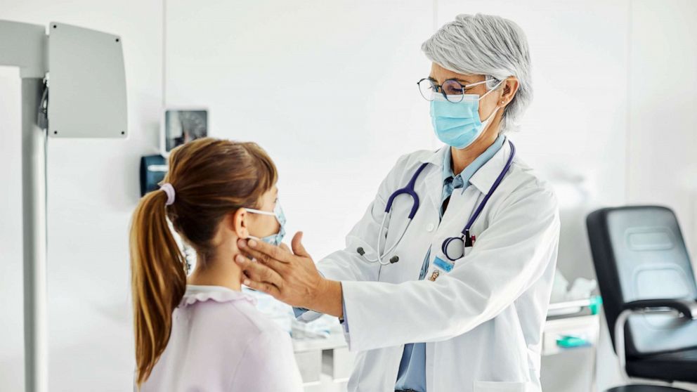 PHOTO: Stock photo of a doctor examining a patient.