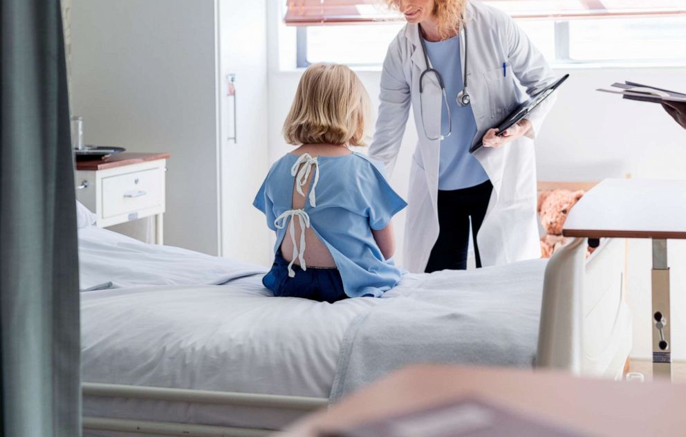 PHOTO: A doctor sees a child patient.