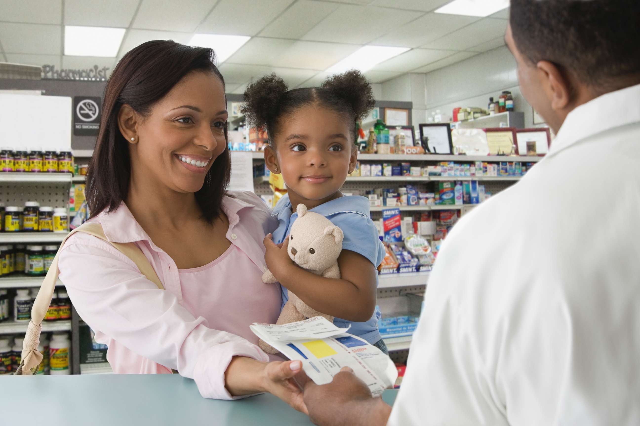 PHOTO: A mother picks up a prescription for her daughter in an undated stock photo. 