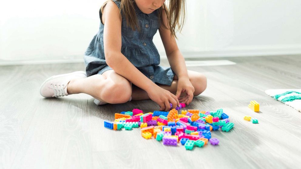 PHOTO: A young girl plays with blocks in this stock photo.