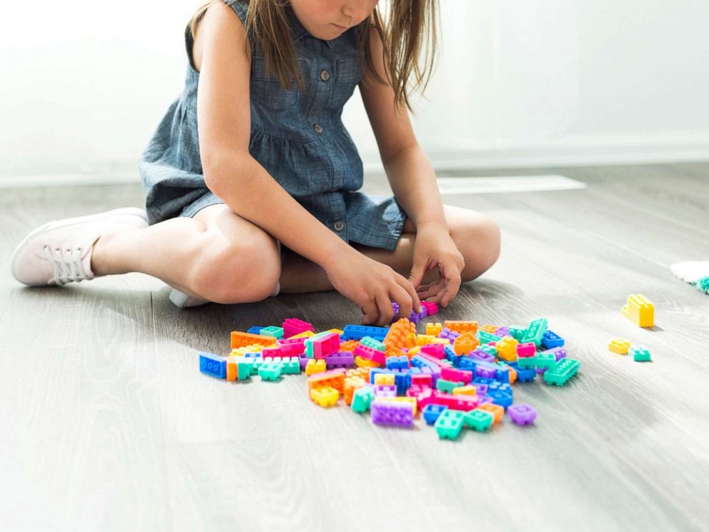 PHOTO: A young girl plays with blocks in this stock photo.