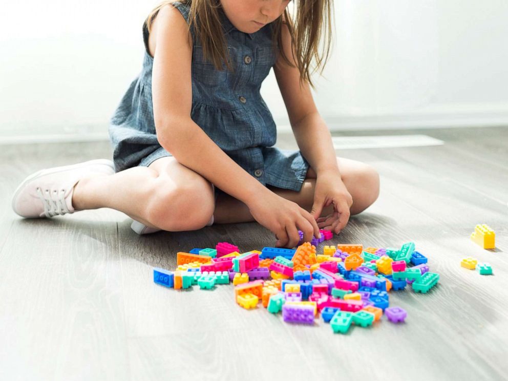 PHOTO: A young girl plays with blocks in this stock photo.