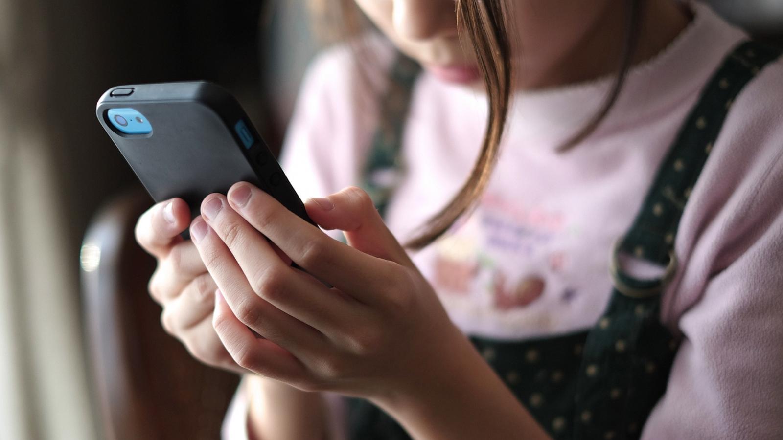 PHOTO: A child uses a smartphone in this stock photo.