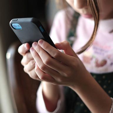 PHOTO: A child uses a smartphone in this stock photo.