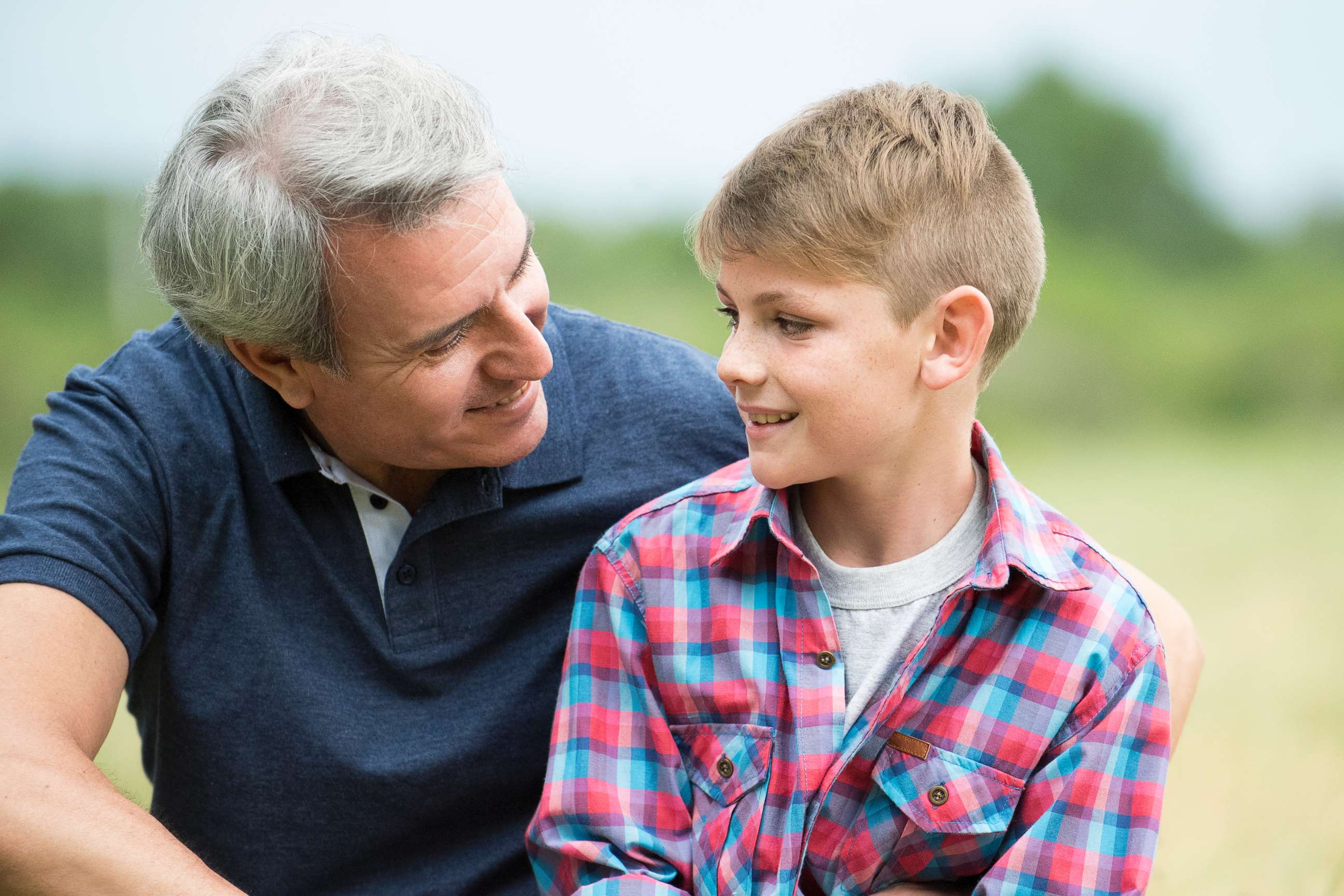 PHOTO: In this undated stock photo, a father has a conversation with his son.