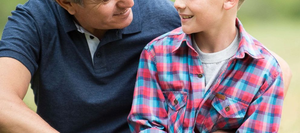 PHOTO: In this undated stock photo, a father has a conversation with his son.
