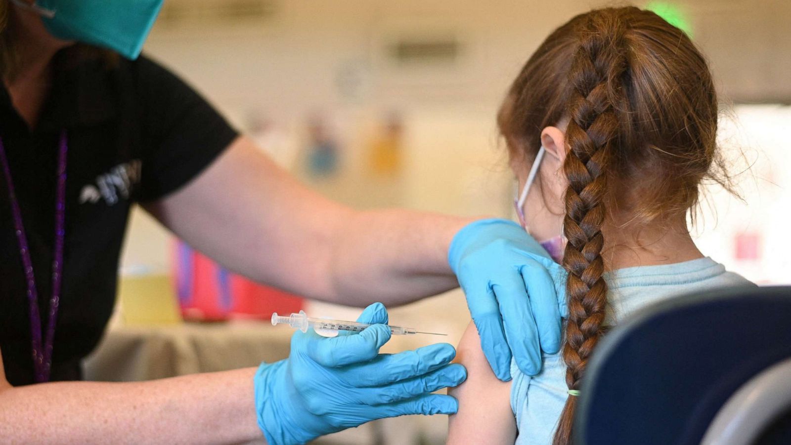 PHOTO: A nurse administers a pediatric dose of the Covid-19 vaccine to a child at a L.A. Care Health Plan vaccination clinic at Los Angeles Mission College in the Sylmar neighborhood in Los Angeles, Jan. 19, 2022.