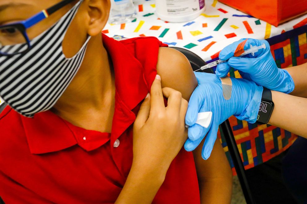 PHOTO: A child receives a dose of the Pfizer-BioNTech COVID-19 vaccine at an elementary school vaccination site for children ages 5 to 11-year-old in Miami, Fla, Nov. 22, 2021.