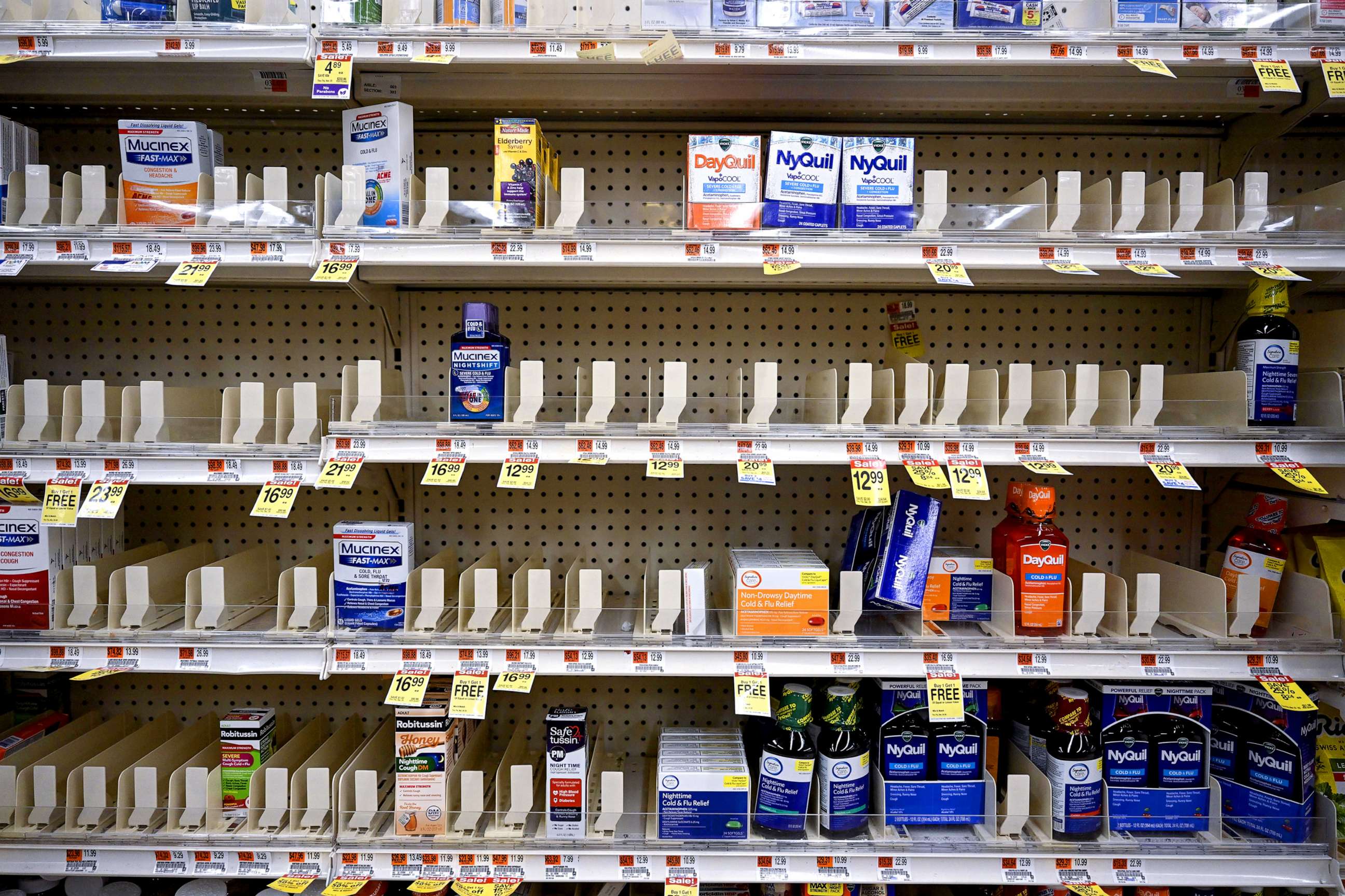 PHOTO: Shelves remain nearly empty near the section for children's medicine, Dec.19, 2022 at a Walgreens, in New York.