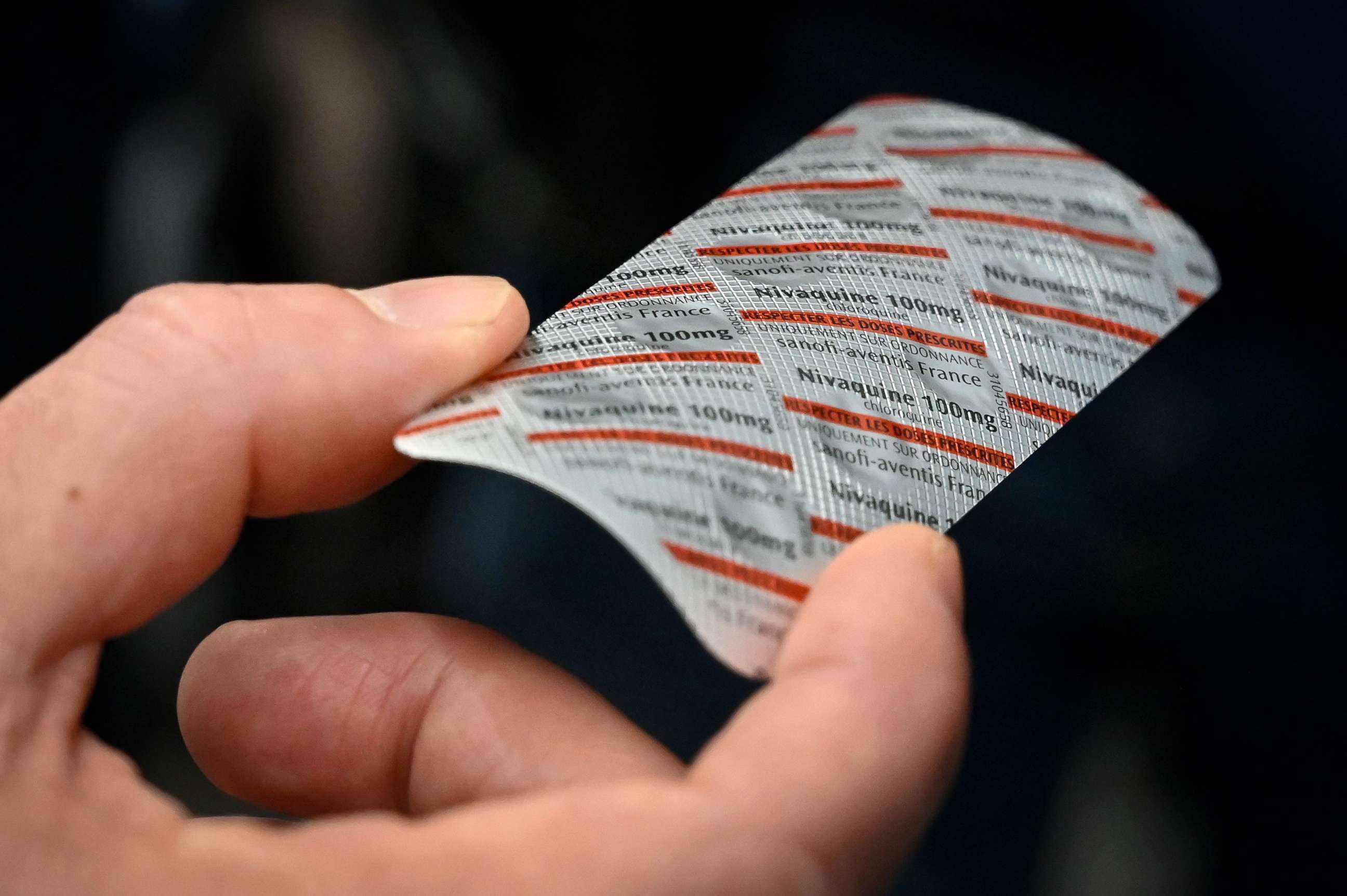 PHOTO: Medical staff shows on Feb. 26, 2020, at the IHU Mediterranee Infection Institute in Marseille, a packet of Nivaquine, containing chloroquine, a malaria drug that has shown signs of effectiveness against coronavirus, according to a study.