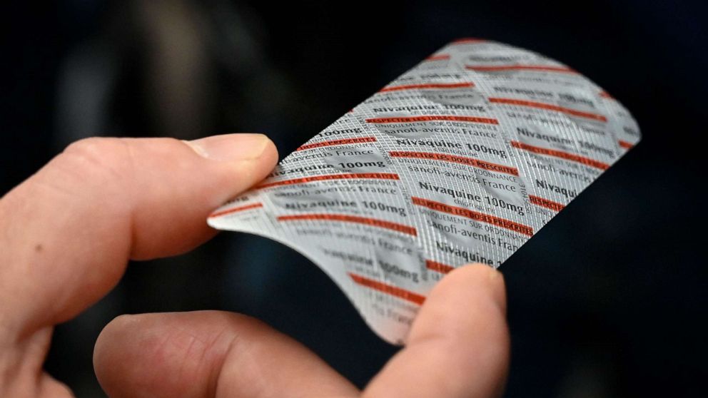 PHOTO: Medical staff shows on Feb. 26, 2020, at the IHU Mediterranee Infection Institute in Marseille, a packet of Nivaquine, containing chloroquine, a malaria drug that has shown signs of effectiveness against coronavirus, according to a study.