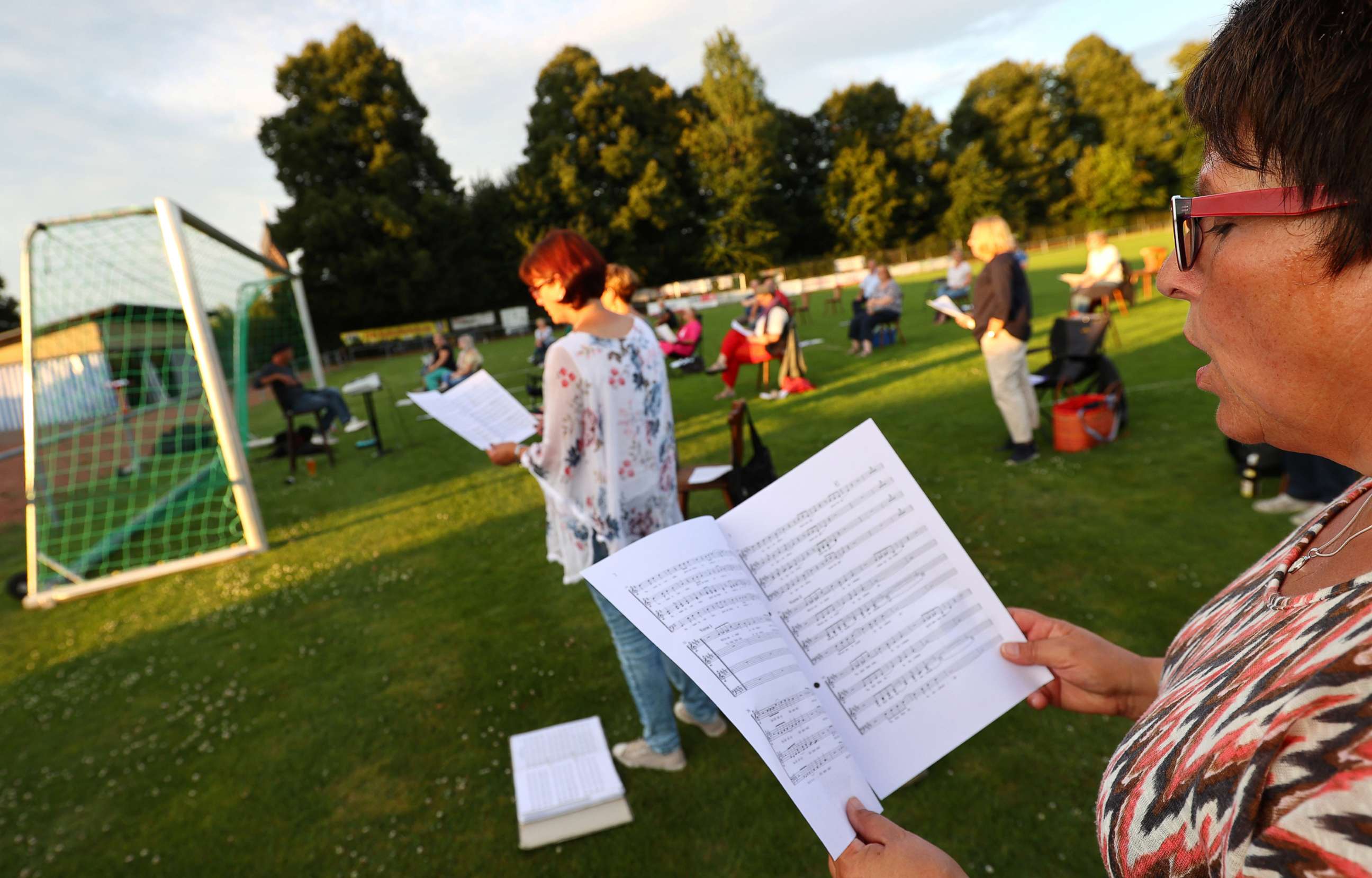 PHOTO: In this July 27, 2020, file photo, members of the local choir "Ton in Ton" (Note by Note) sing during the weekly rehearsal under restrictions due to the outbreak of COVID-19 in Hanau near Frankfurt, Germany.