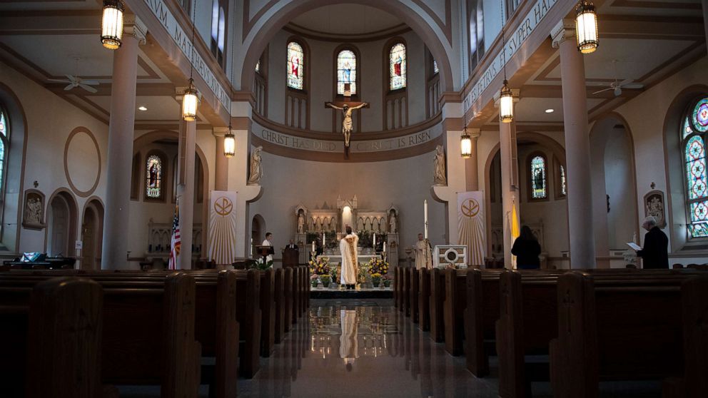 PHOTO: Fr. Brendan conducts a live-stream of an Easter Vigil Mass at Saint Peter's Church on Capitol Hill without worshipers due to the coronavirus outbreak, April 12, 2020.