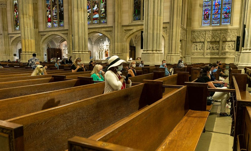 PHOTO: A woman prays during St. Patrick's Cathedral on the first public Mass when it stopped in-person attendance during the COVID-19 pandemic, June, 28, 2020, in New York. 