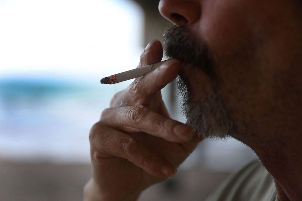 PHOTO: A man smokes a cigarette as he visits the beach in Dania Beach, Fla., Jan. 3, 2019.