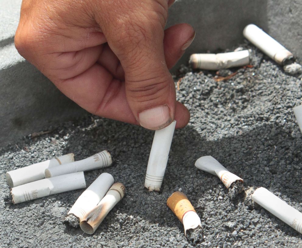 PHOTO: A smoker snuffs out a cigarette at the Capitol in Sacramento, Calif., June 22, 2012.