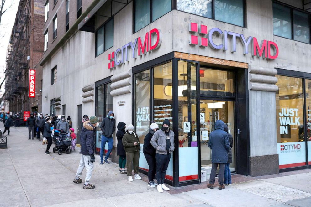 PHOTO: People wait in a queue to enter CityMD, a health clinic that offers coronavirus disease (COVID-19) testing, on the Upper West Side in Manhattan, New York City, Dec. 19, 2021.