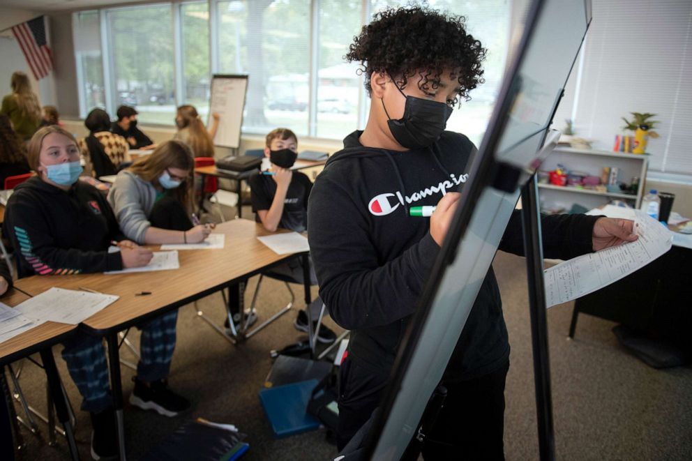 PHOTO: Mickle Middle School eighth grade student Omari Clark leads a group discussion during an AVID class, a college-readiness elective, Oct. 21, 2021, in Lincoln, Neb.