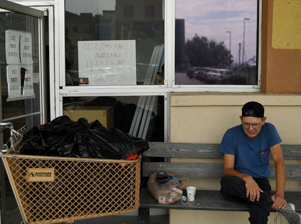 PHOTO: Scott Helms sits outside his hotel lobby where he has a room on Sept. 2, 2021, in Denver. 