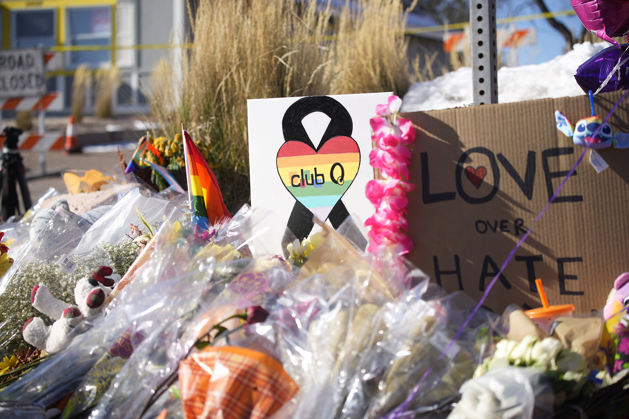 PHOTO: Bouquets of flowers sit on a corner near the site of a mass shooting at a gay bar in Colorado Springs, Colo., Nov. 21, 2022.
