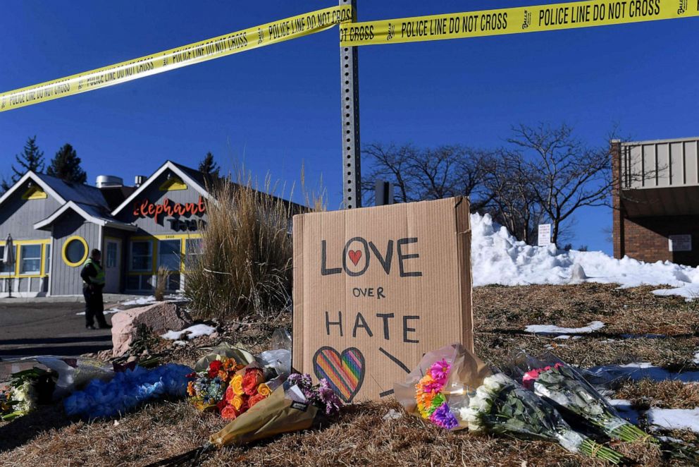 PHOTO: Bouquets of flowers and a sign reading "Love Over Hate" are left near Club Q, an LGBTQ nightclub in Colorado Springs, Colorado, on Nov. 20, 2022.