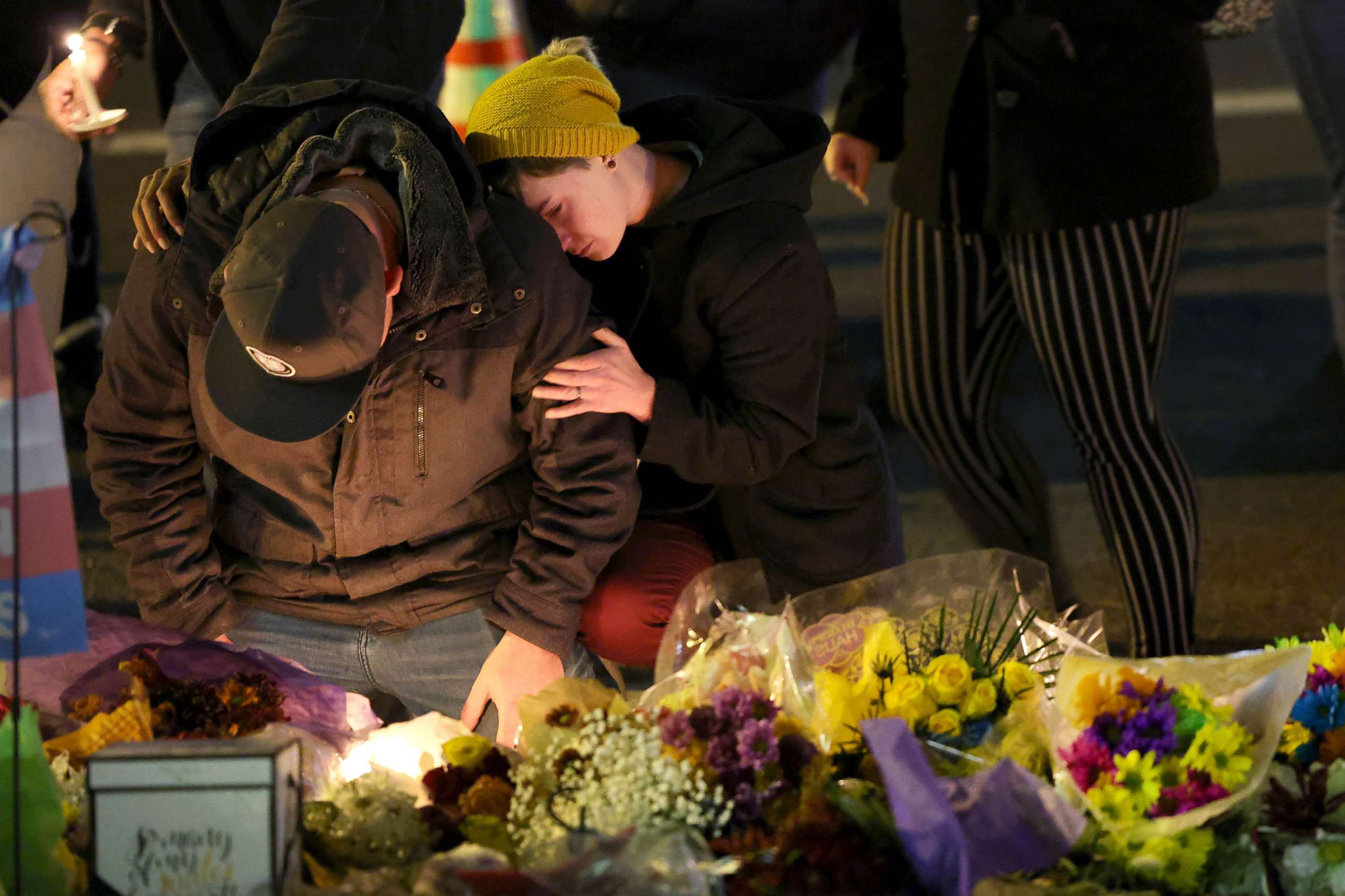 PHOTO: People hold a vigil at a makeshift memorial near the Club Q nightclub, Nov. 20, 2022 in Colorado Springs, Colorado.
