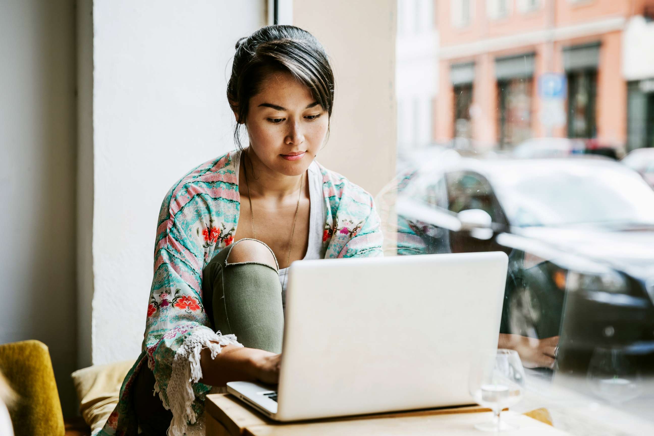 PHOTO: A woman uses a laptop in this stock photo.