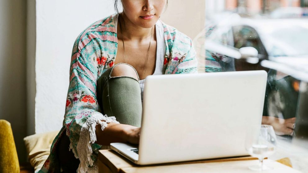 PHOTO: A woman uses a laptop in this stock photo.
