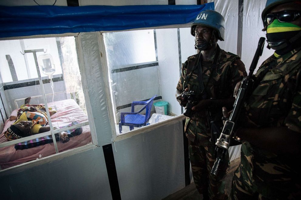 PHOTO: United Nations peacekeepers stand next to a patient during a visit of the UN Secretary-General at an ebola treatment center in Democratic Republic of Congo, Sept. 1, 2019.