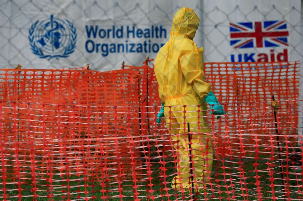 PHOTO: A person dressed in Ebola protective apparel is seen inside an Ebola care facility at the Bwera general hospital near the border with the Democratic Republic of Congo in Bwera, Uganda, June 14, 2019.