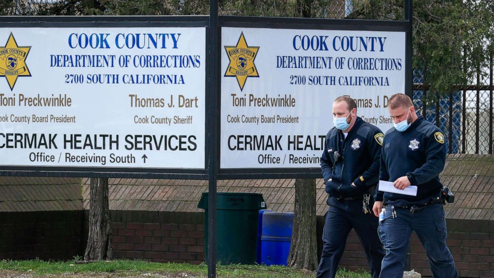 PHOTO: Two Cook County employees leave the Cook County Jail in Chicago, April 10, 2020. The jail with nearly 4500 inmates has been hit hard by the coronavirus SARS-CoV-2 which causes the COVID-19.