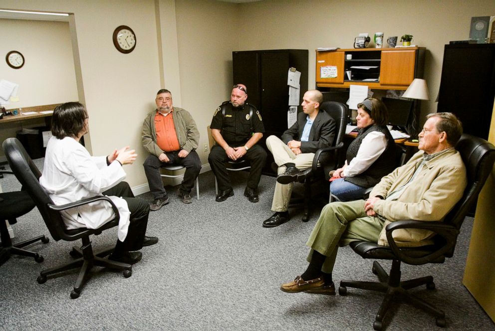 PHOTO: Dr. William Cooke, far left, speaks during a meeting with local and state officials about an HIV outbreak in Scott County at Foundations Family Medicine in downtown Austin, Ind., on March 24, 2015.