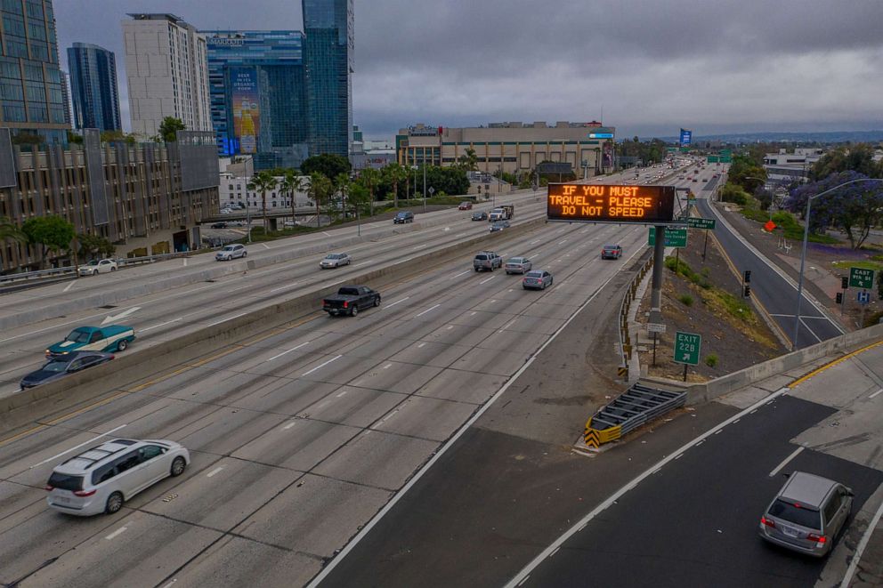 PHOTO: An aerial view shows a sign imploring drivers to not speed while morning traffic gradually increases on the Interstate 110 freeway as the coronavirus pandemic continues, in Los Angeles, May 18, 2020.