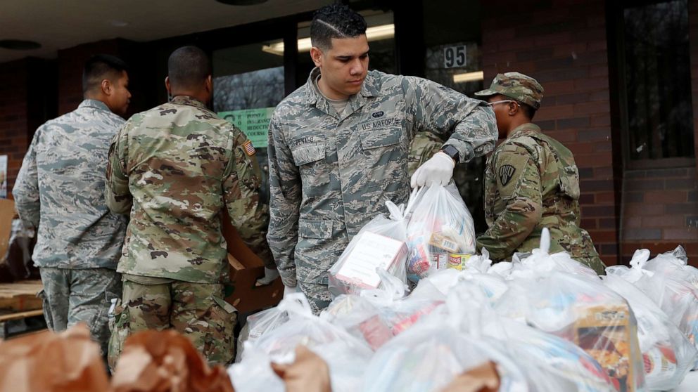 PHOTO: National Guard troops set up food donations in New Rochelle, New York, U.S., March 12, 2020.