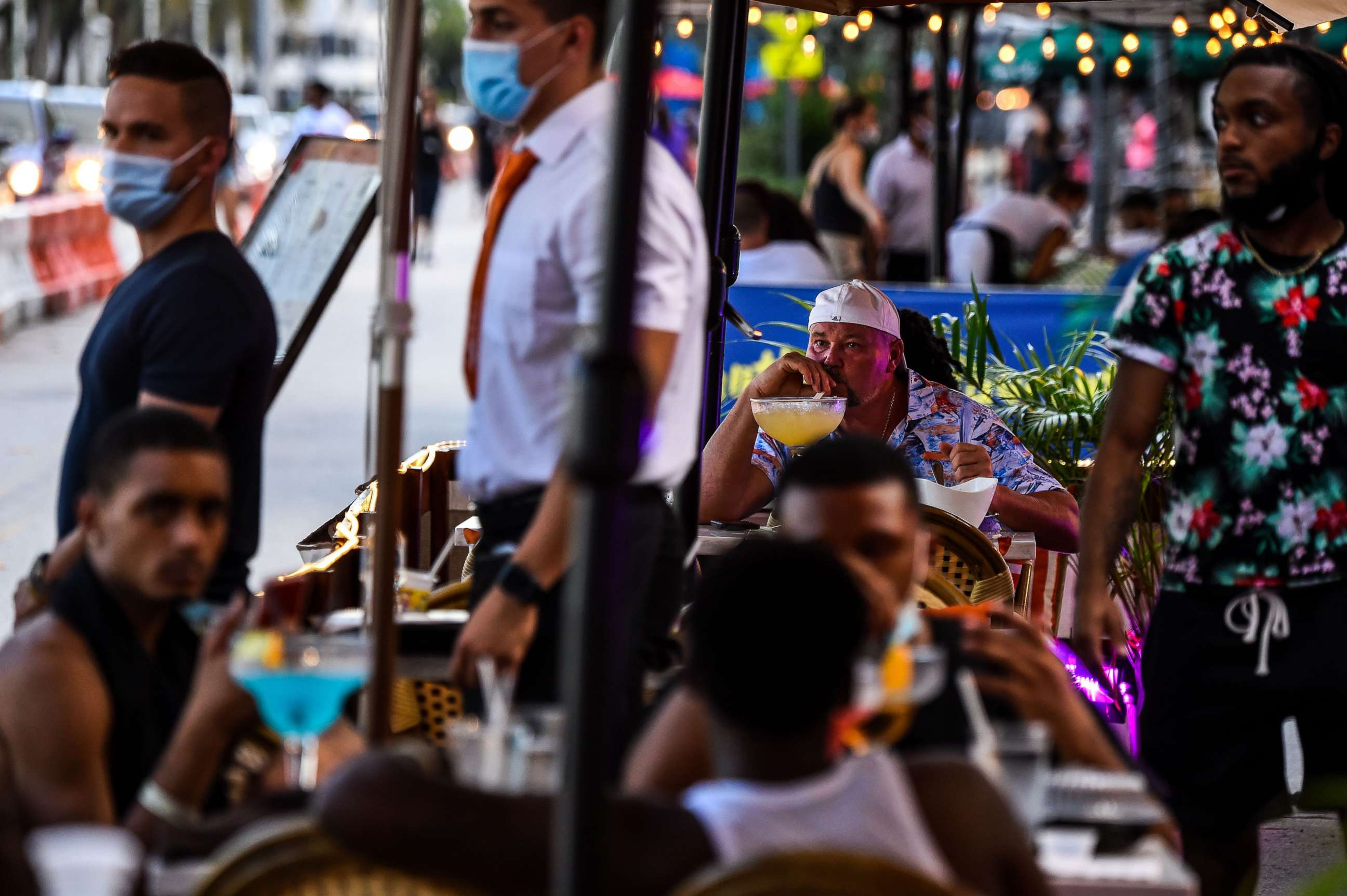 PHOTO: A man enjoys a drink at a restaurant on Ocean Drive in Miami Beach, Fla., July 14, 2020, during the coronavirus pandemic.