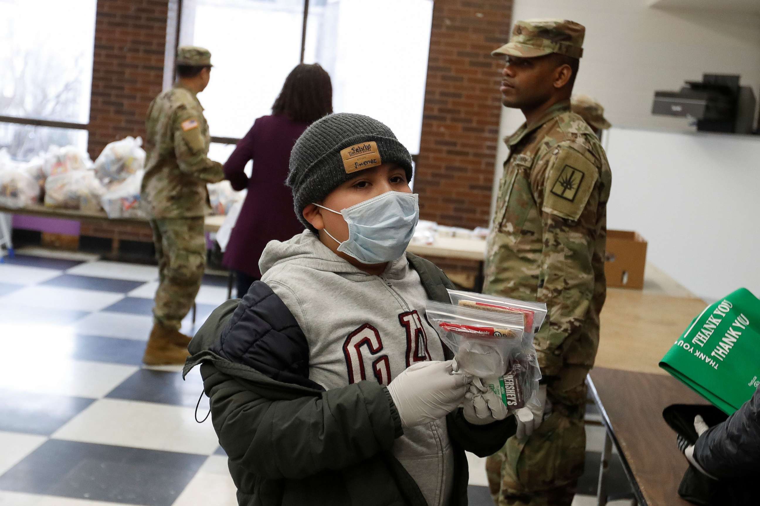 PHOTO: 10-year-old Selvin Jimenez receives food donations From the National Guard in New Rochelle, N.Y., March 12, 2020.