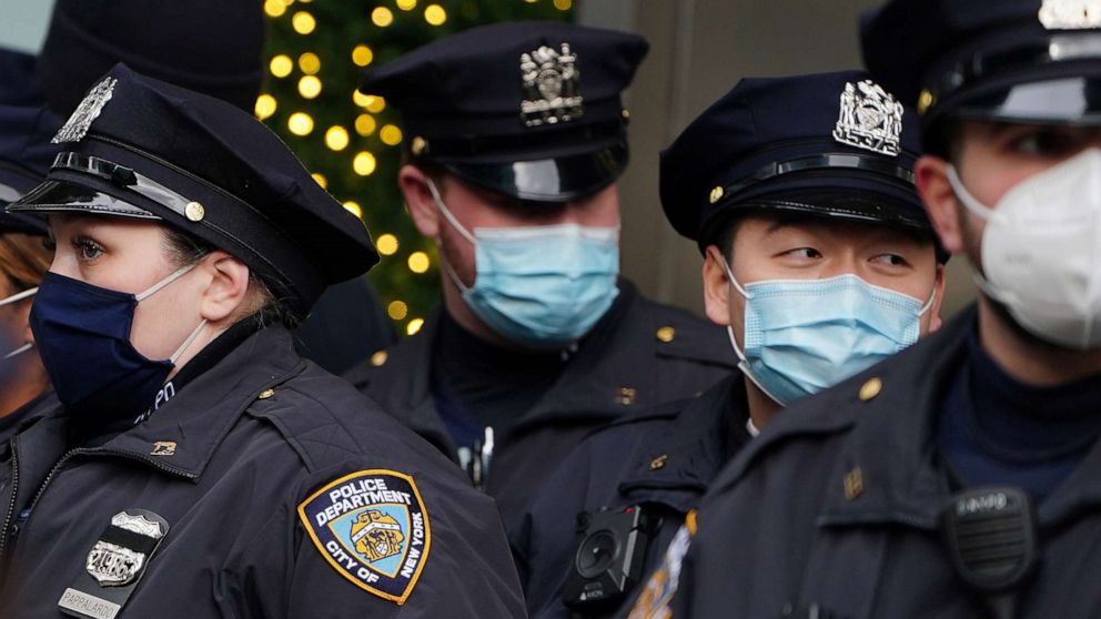 PHOTO: Police attend a muster point near Times Square ahead of New Year's Eve amid the coronavirus disease pandemic in the Manhattan borough of New York, Dec. 31, 2020.