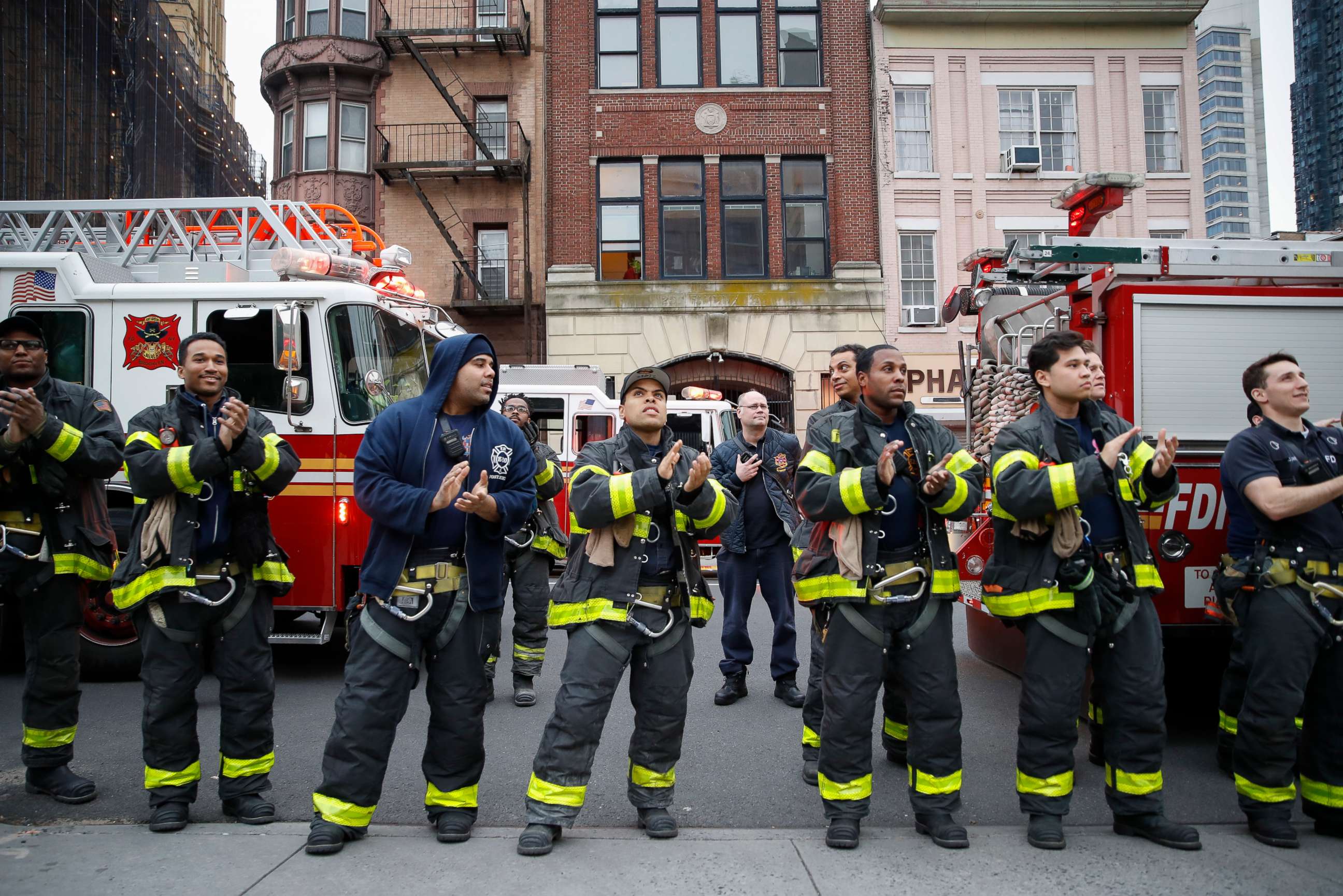 PHOTO: FDNY firefighters gather to applaud medical workers at 7pm outside Brooklyn Hospital Center, April 14, 2020, in New York.