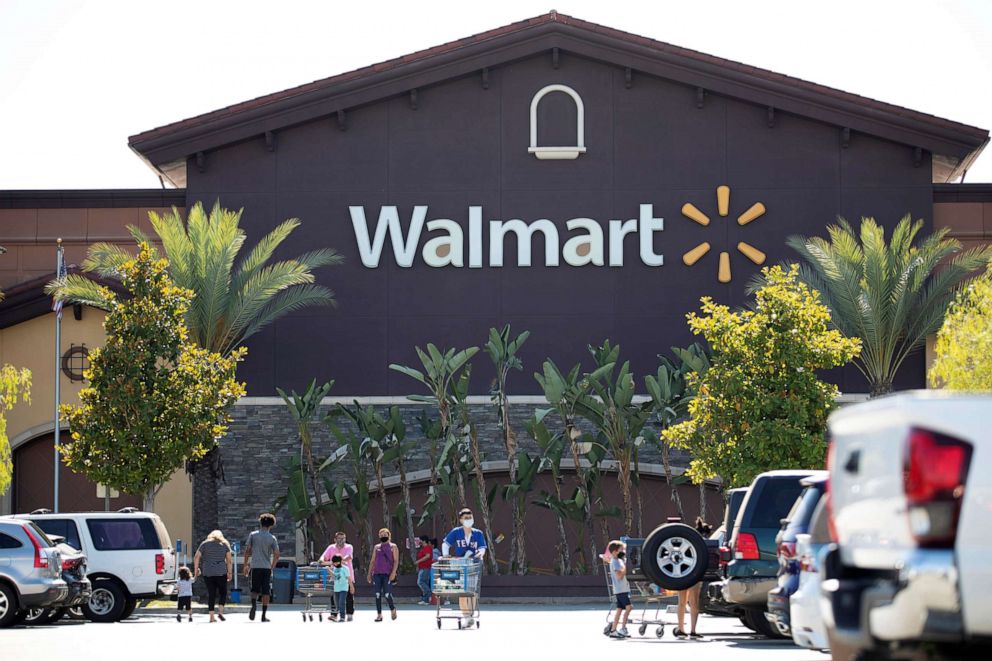 PHOTO: Shoppers wearing face masks are pictured in the parking of a Walmart Superstore during the outbreak of the coronavirus disease in Rosemead, Calif., June 11, 2020.