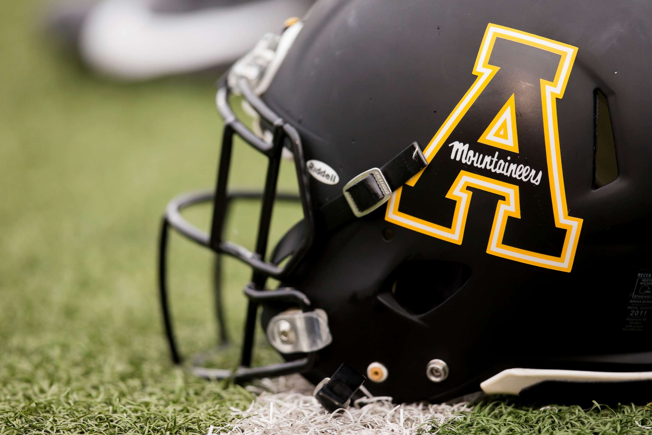 PHOTO: An Appalachian State University helmet sits on the ground before a game at Kidd Brewer Stadium in Boone, N.C., Oct. 19, 2019.