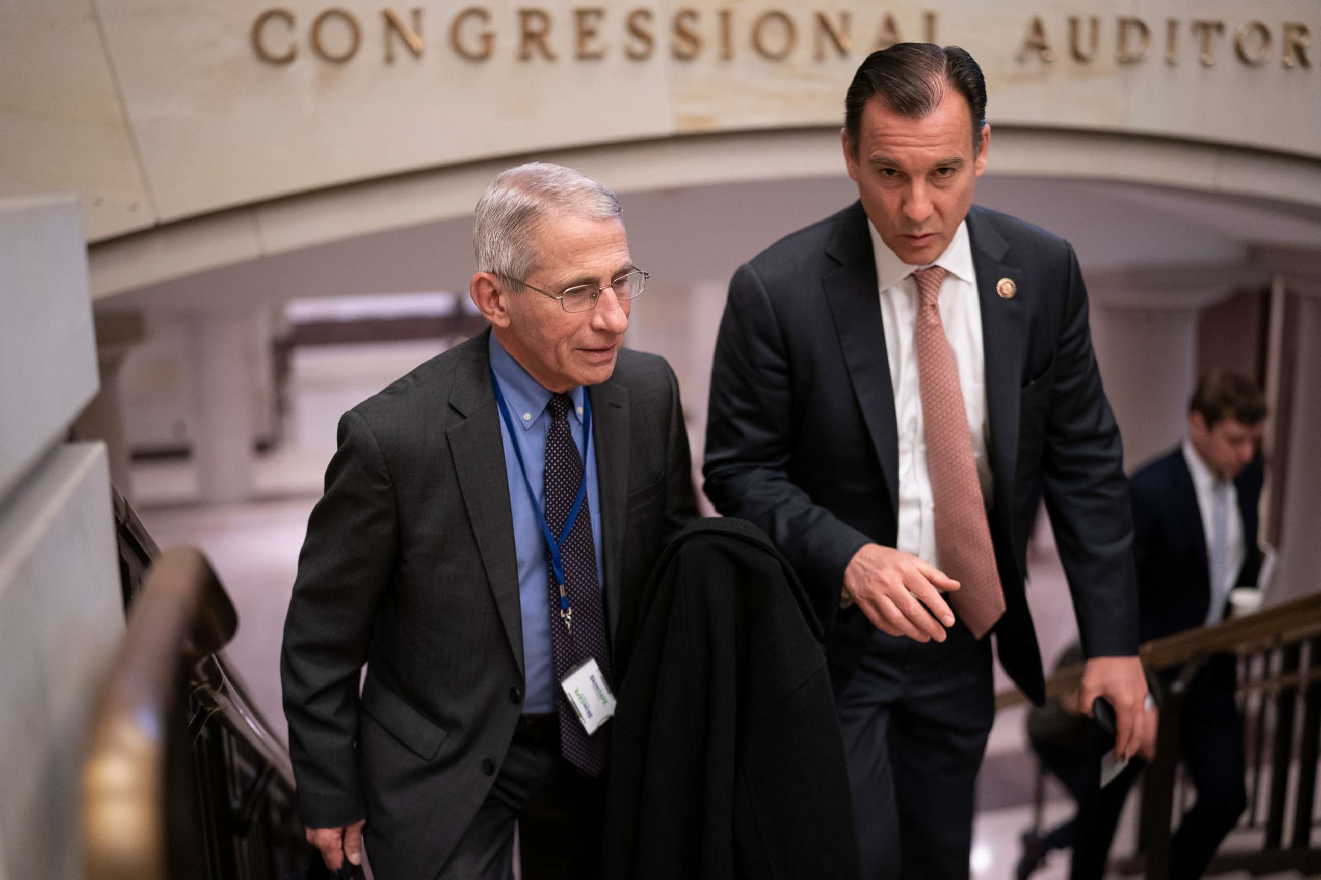 PHOTO: Dr. Anthony Fauci, left, director of the National Institute of Allergy and Infectious Diseases, speaks with Rep. Tom Suozzi after updating members of Congress on the coronavirus outbreak, on Capitol Hill in Washington, March 12, 2020.