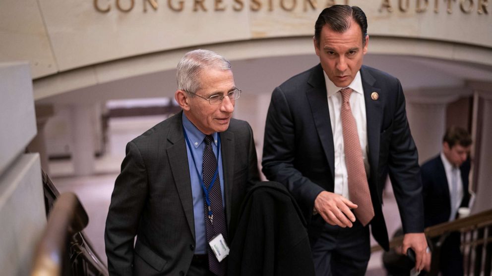 PHOTO: Dr. Anthony Fauci, left, director of the National Institute of Allergy and Infectious Diseases, speaks with Rep. Tom Suozzi after updating members of Congress on the coronavirus outbreak, on Capitol Hill in Washington, March 12, 2020.