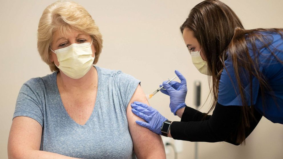 PHOTO: RN Clinical Staff Educator Diane Mikelsons receives a mock Pfizer vaccine for the coronavirus disease during a staff vaccine training session at UW Health in Madison, Wis., Dec. 8, 2020.
