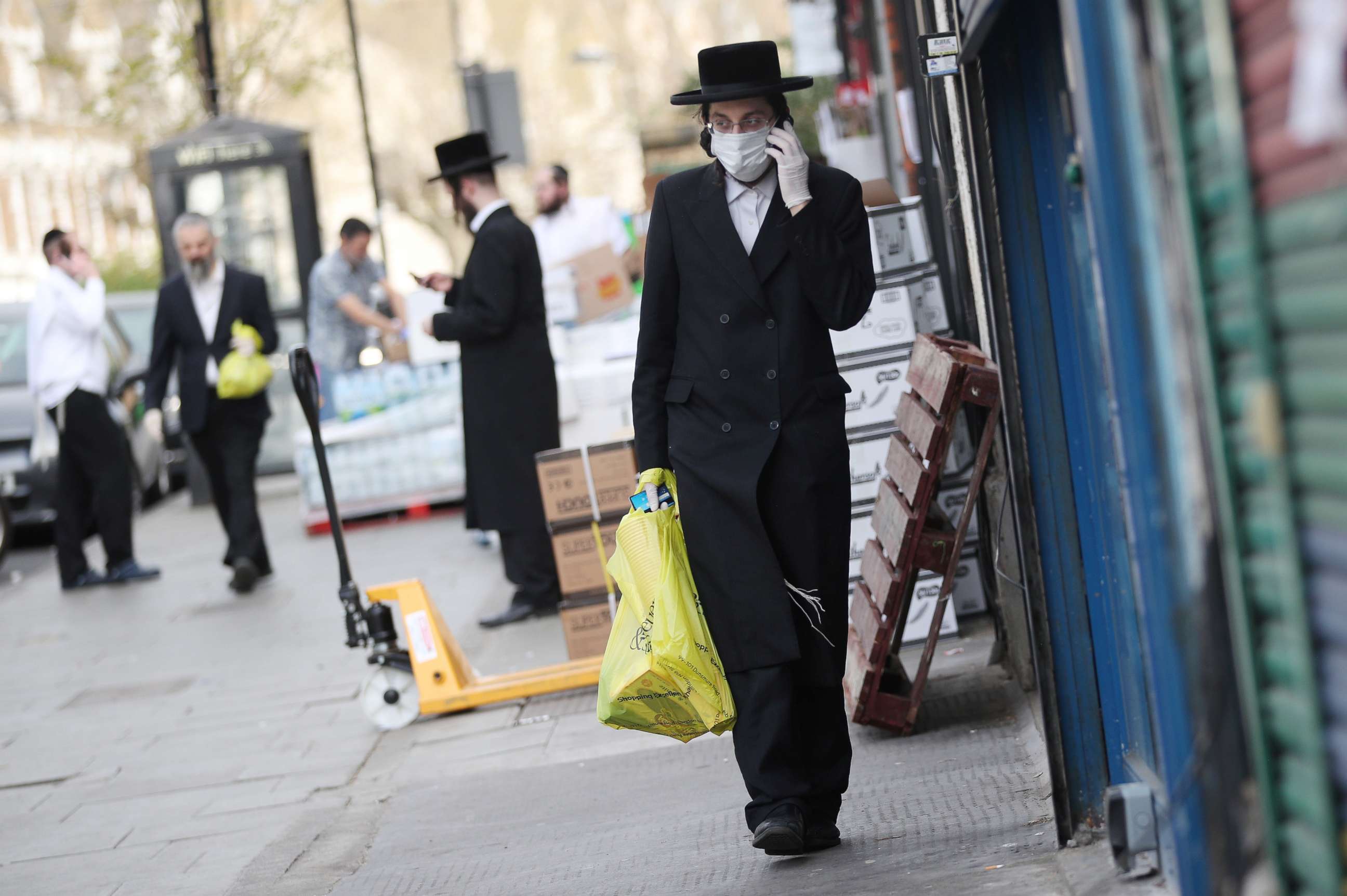 PHOTO: An Orthodox Jewish man wearing a protective face mask and gloves is seen in the Stamford Hill neighborhood of London as the spread of the coronavirus disease continues, April 8, 2020.