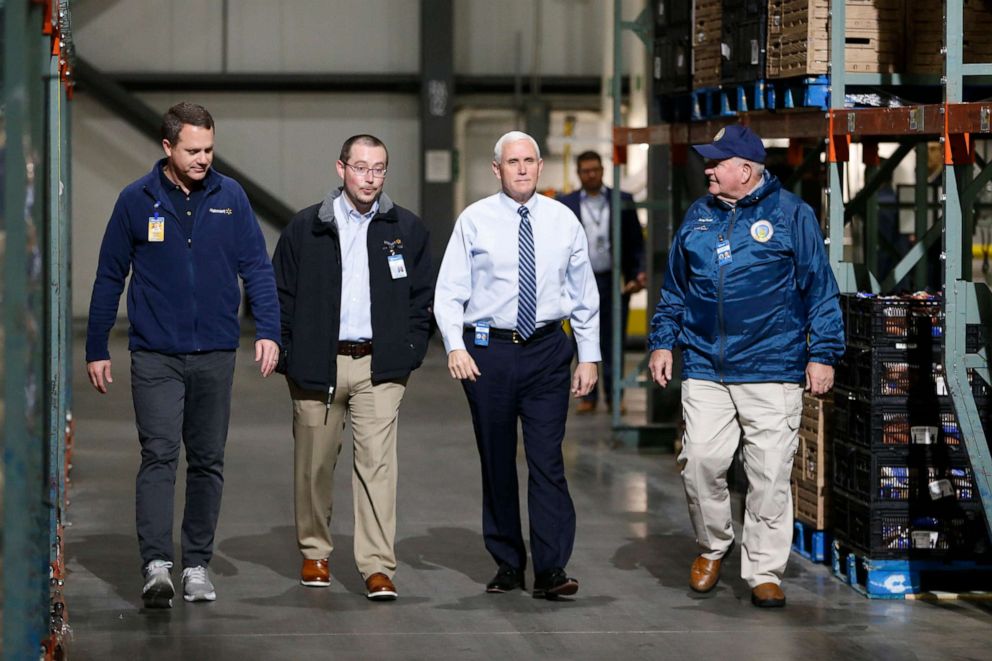PHOTO: Vice President Mike Pence tours a Walmart Distribution Center with president and CEO of Walmart, Doug McMillon, Agriculture Secretary Sonny Purdue, and general manager, Larry Williams, April 1, 2020, in Gordonsville, Va.